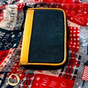 Lightly used wallet that is filled with tons on organizing sections